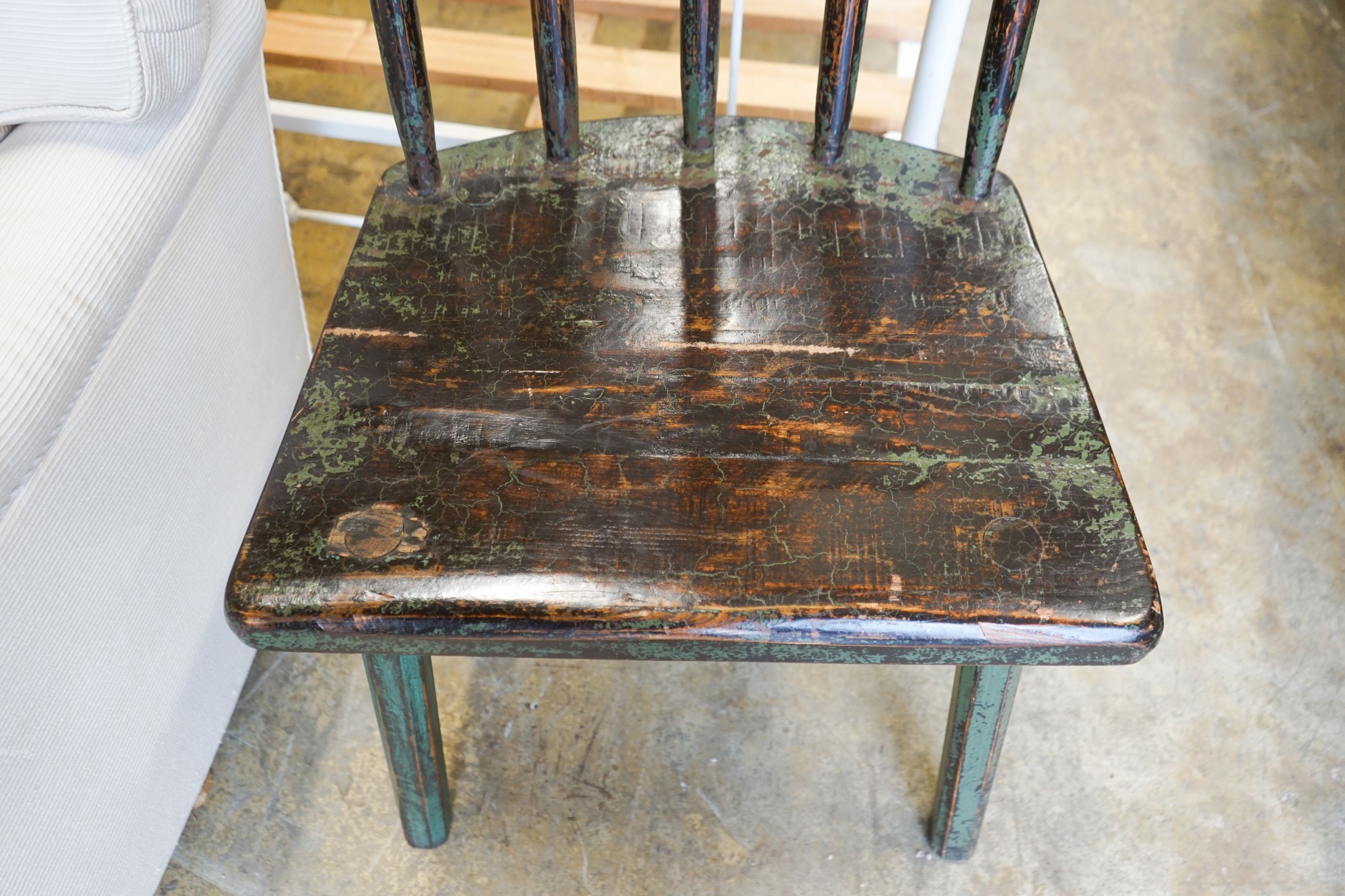 A painted primitive style comb back side chair, width 55cm, depth 45cm, height 94cm